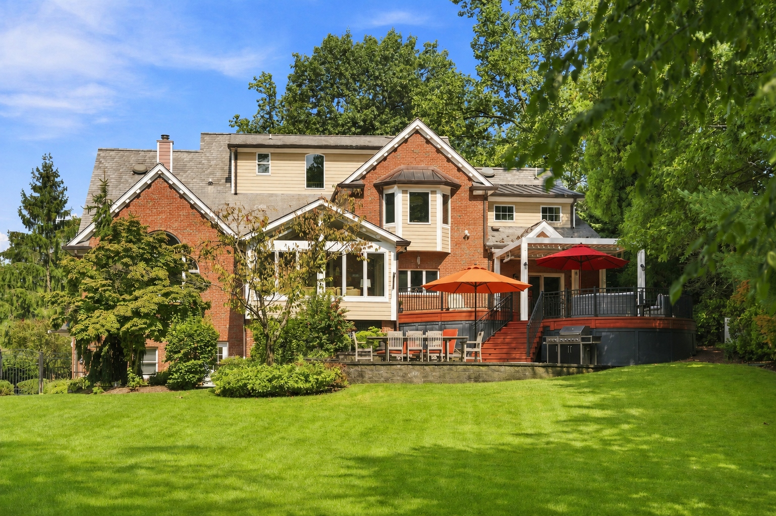 Two-tier patio and expansive rear lawn at 285 Hartshorn Drive, Short Hills