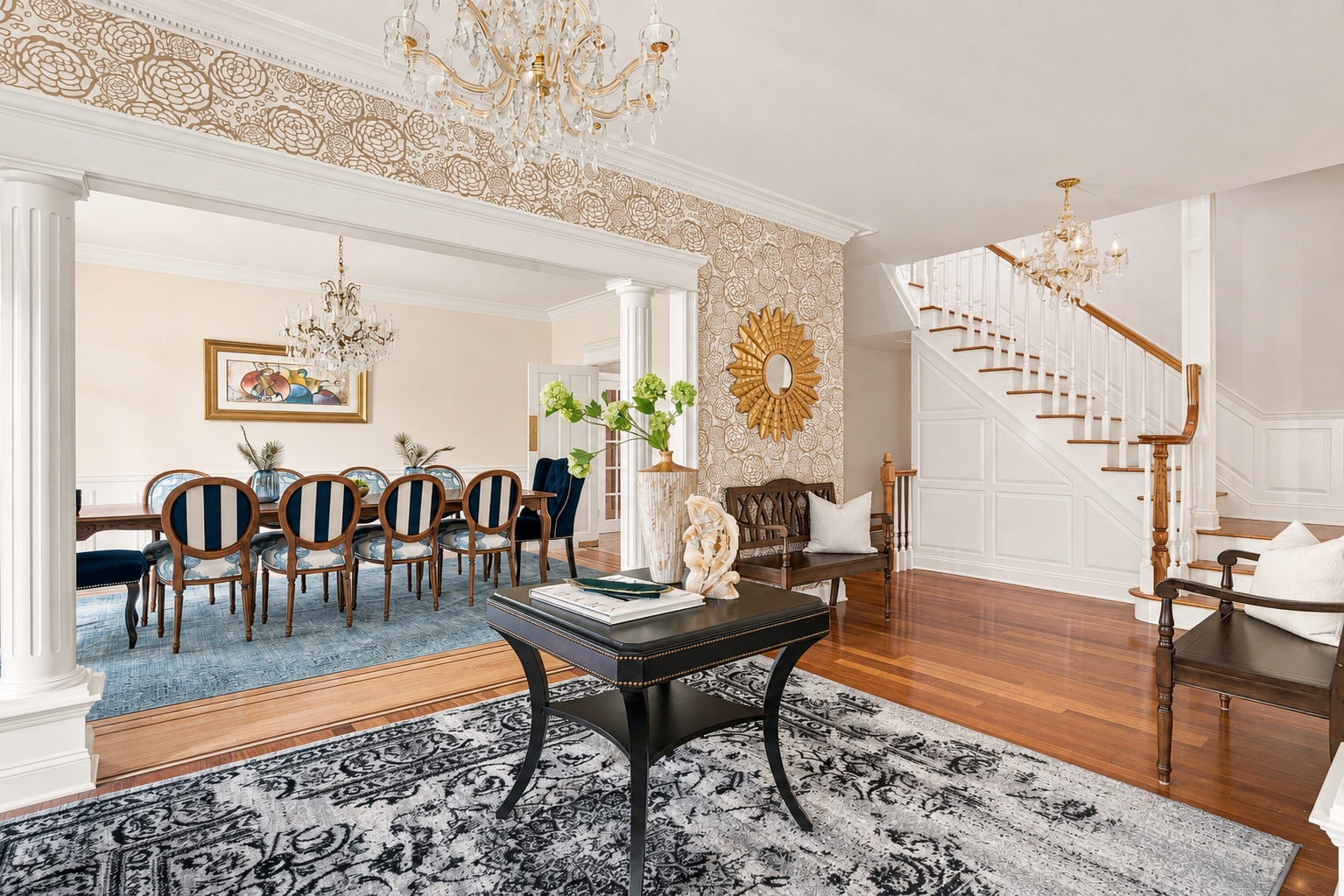 Foyer with crystal chandelier and curved staircase at 285 Hartshorn Drive, Short Hills